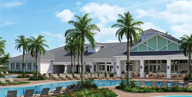 a front view of a building with palm trees