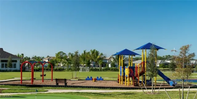 a view of a park with big trees