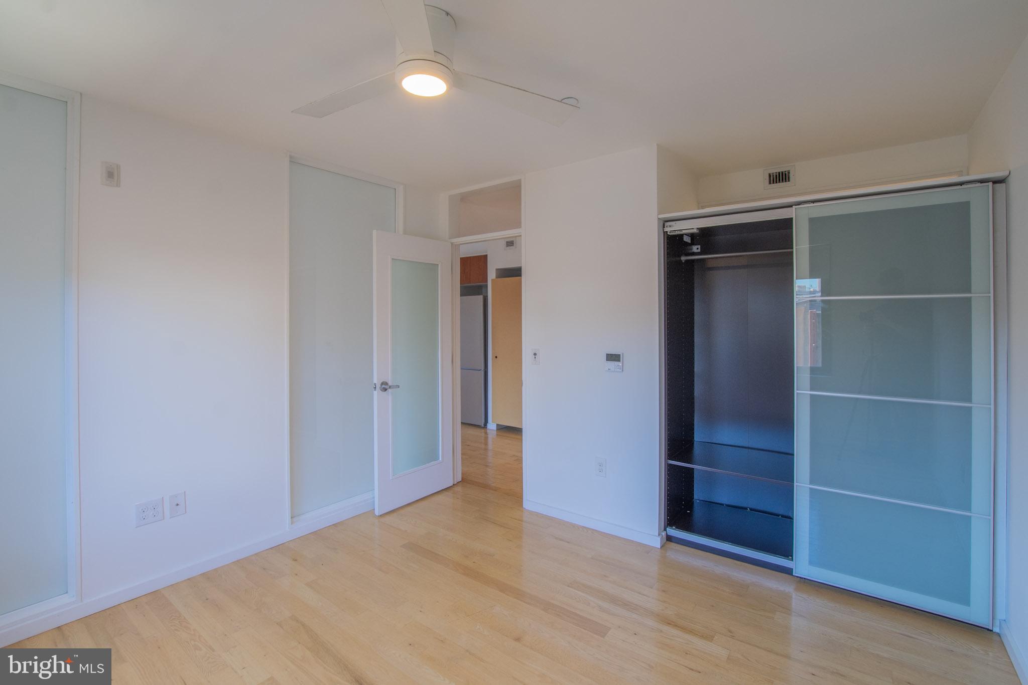 152 West Laurel Street, Unit 303 Philadelphia, PA 19123 - Photo 18 of 36 a view of an empty room with closet and a window