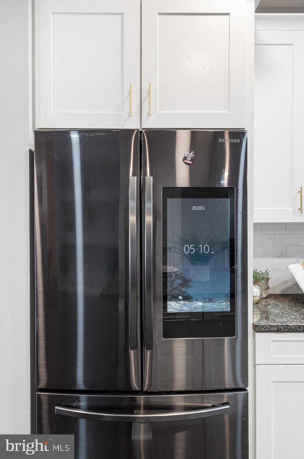7429 Matapan Drive Hanover, MD 21076 - Photo 14 of 37 a close view of kitchen with stainless steel appliances granite countertop a refrigerator and a counter top