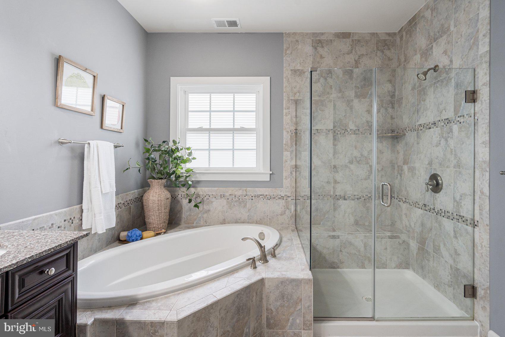 7429 Matapan Drive Hanover, MD 21076 - Photo 20 of 37 a white bath tub sitting next to a shower
