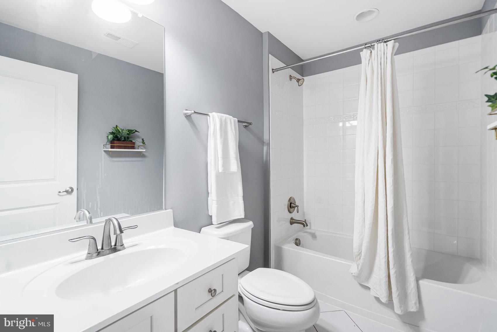 7429 Matapan Drive Hanover, MD 21076 - Photo 29 of 37 a bathroom with a sink toilet and shower