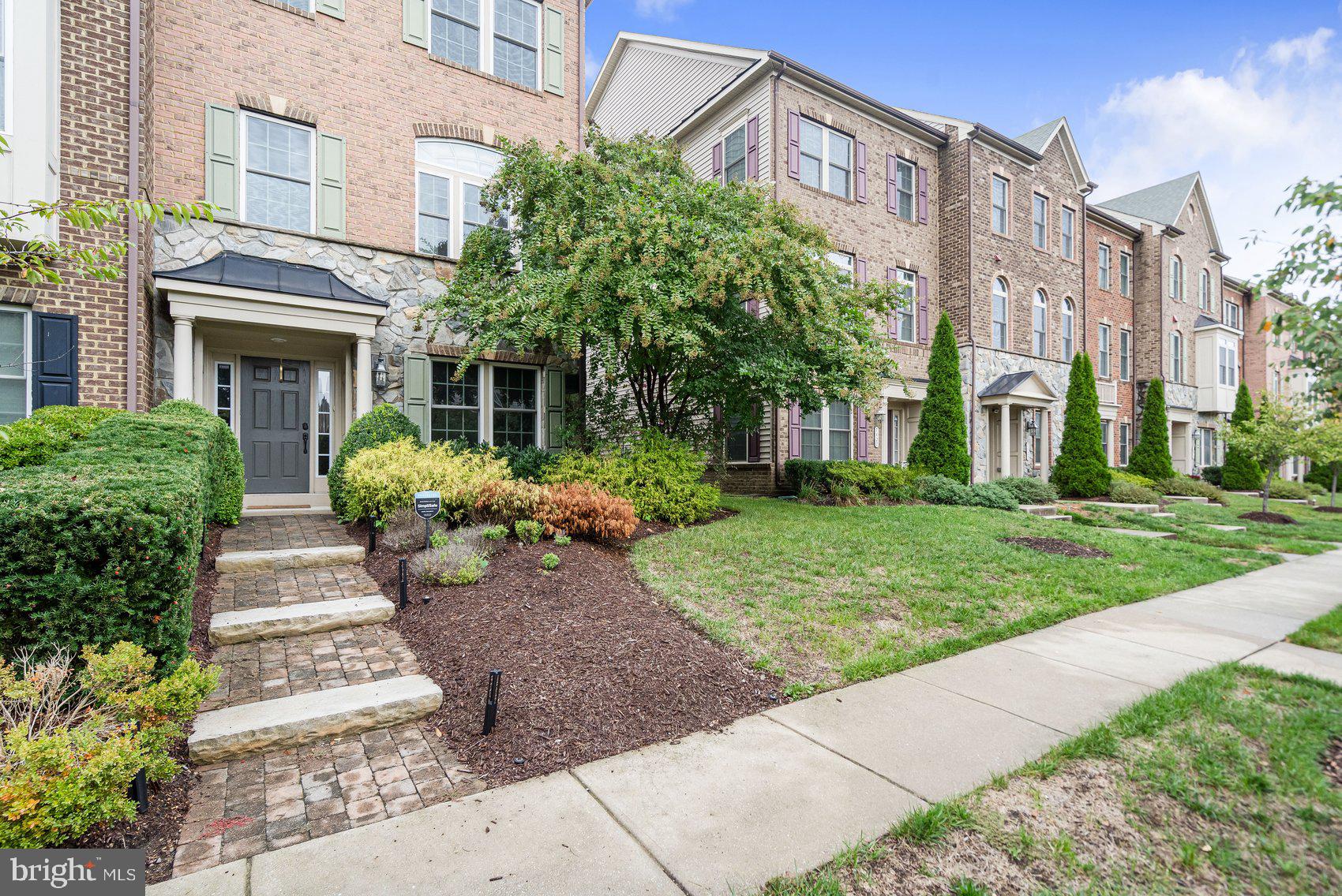 7429 Matapan Drive Hanover, MD 21076 - Photo 3 of 37 a view of a building with a garden