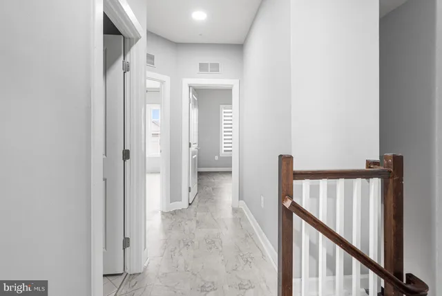 a view of entryway with stairs and wooden floor