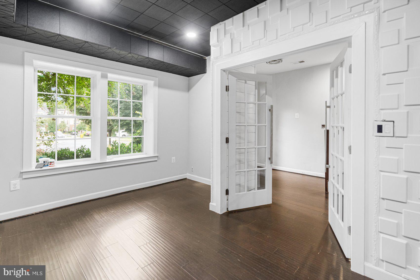 7429 Matapan Drive Hanover, MD 21076 - Photo 34 of 37 an empty room with wooden floor and windows