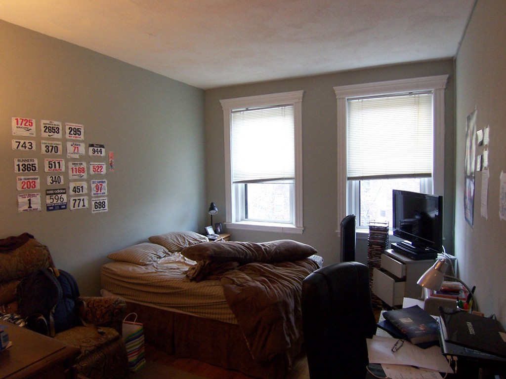61 Park Drive, Unit 6 Boston, MA 02215 - Photo 2 of 7 a bed room with furniture and a window