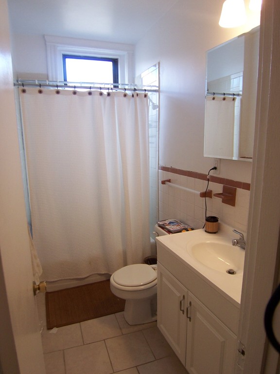 61 Park Drive, Unit 6 Boston, MA 02215 - Photo 4 of 7 a bathroom with a sink a toilet and shower