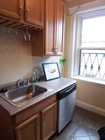 a kitchen with a sink and a window