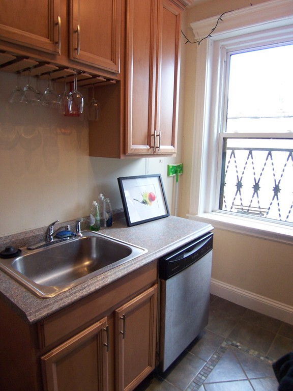 61 Park Drive, Unit 6 Boston, MA 02215 - Photo 6 of 7 a kitchen with a sink and a window