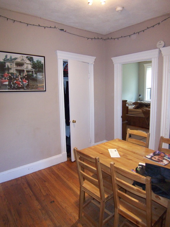 61 Park Drive, Unit 6 Boston, MA 02215 - Photo 7 of 7 a bedroom with a bed and a table in it