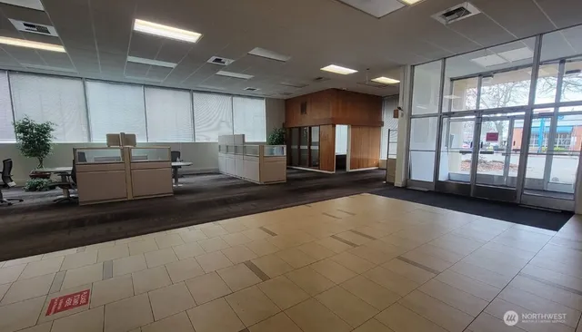 a kitchen with stainless steel appliances kitchen island granite countertop a sink and cabinets