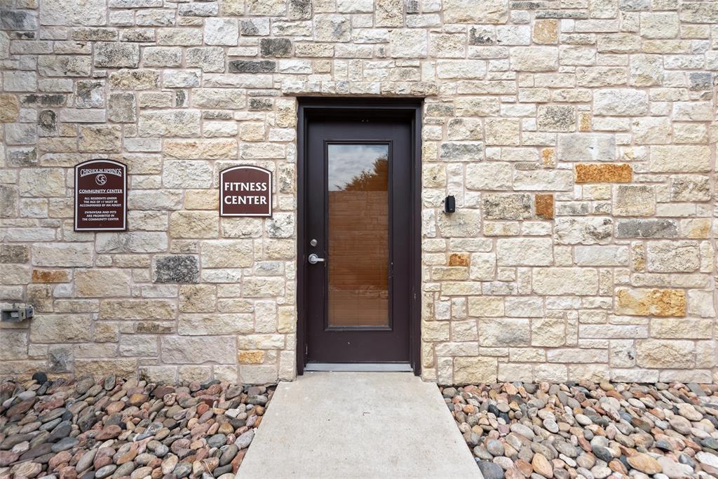 149 Cattlemans Creek Road Newark, TX 76071 - Photo 35 of 39 Entrance to community fitness center at 149 Cattlemans Creek Rd in the Chisholm Springs neighborhood in Newark, TX 76071