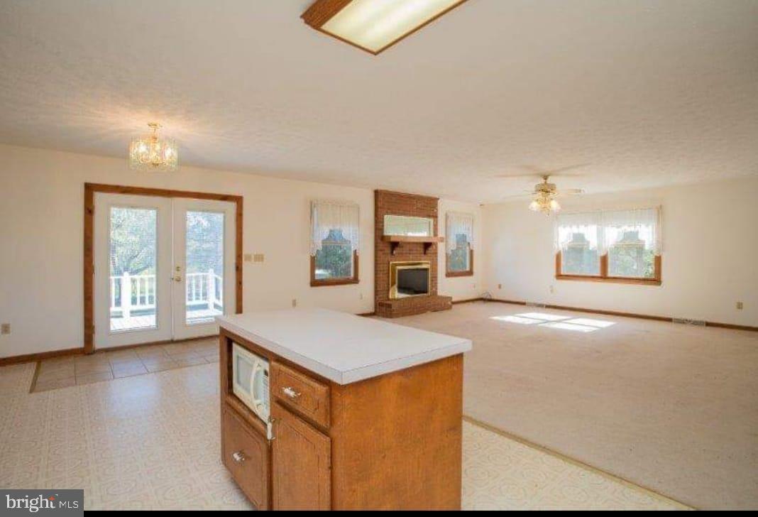 9001 Stage Coach Road Nathalie, VA 24577 - Photo 10 of 19 Spacious living area with natural light.