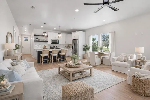 a living room with furniture and white walls