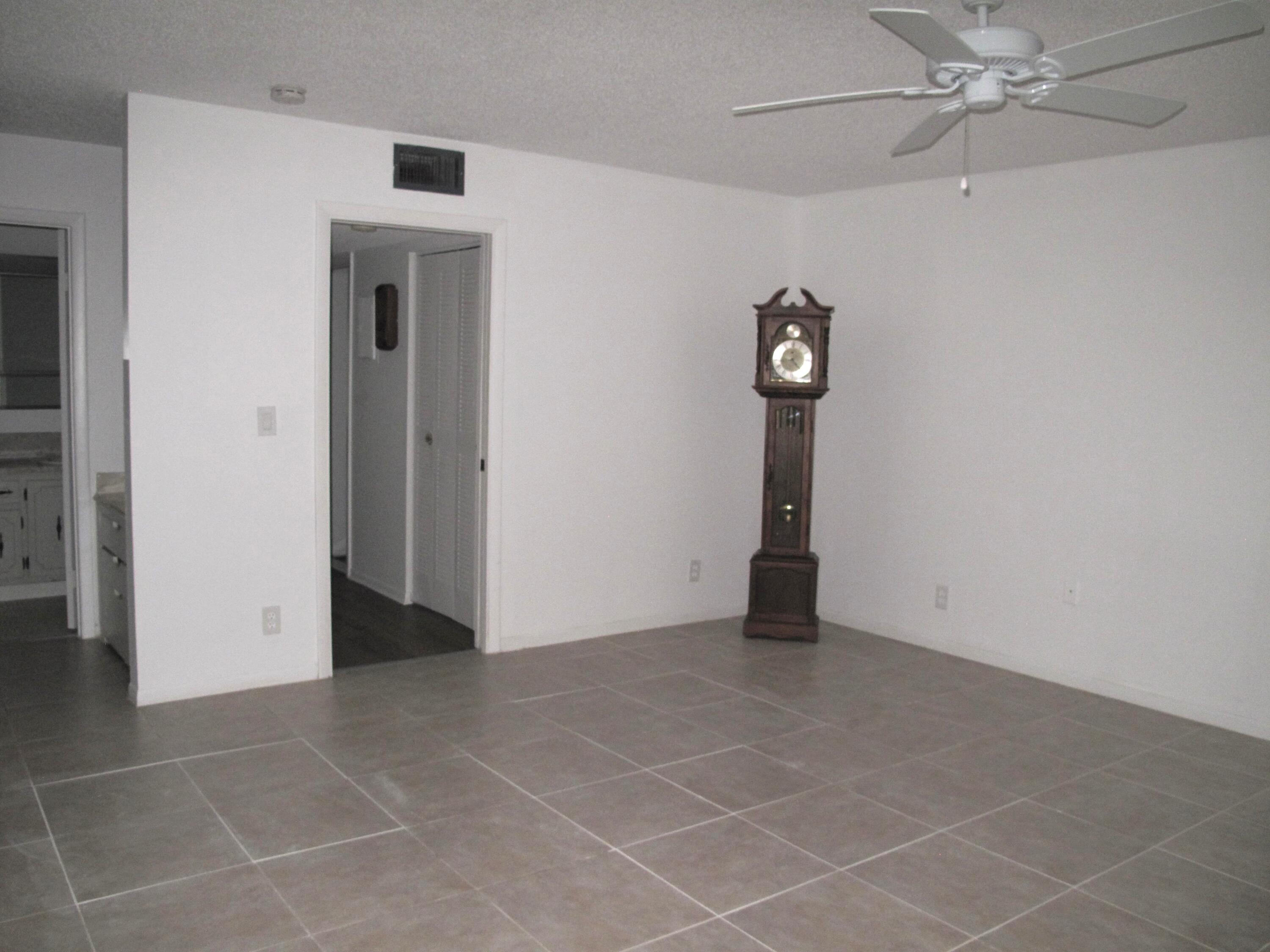 1162 Circle Drive, Unit B Delray Beach, FL 33445 - Photo 13 of 31 a view of an entryway with table and door