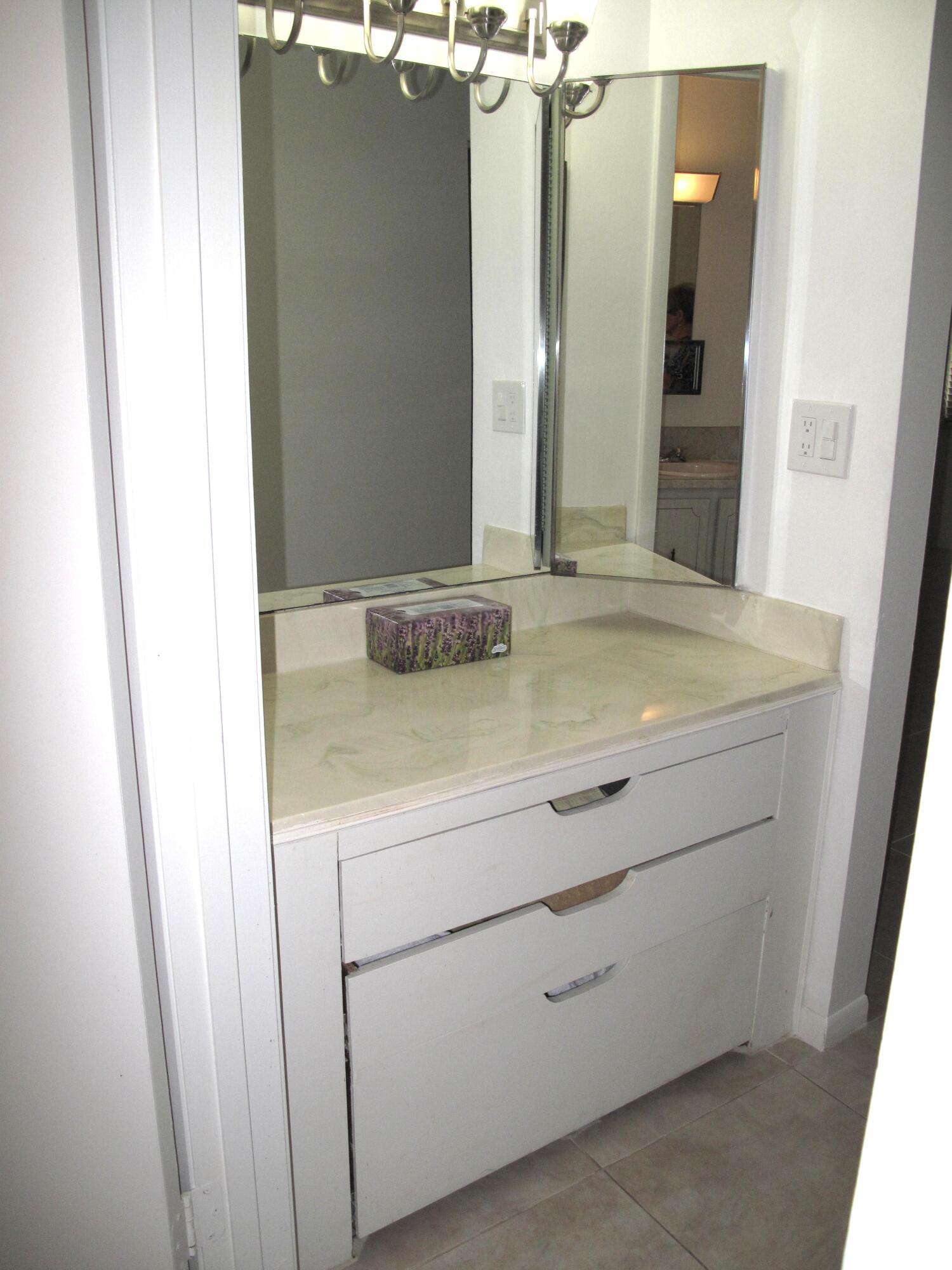 1162 Circle Drive, Unit B Delray Beach, FL 33445 - Photo 17 of 31 a sink with a mirror