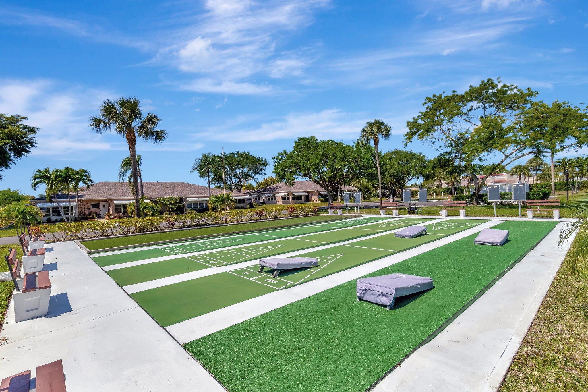 1162 Circle Drive, Unit B Delray Beach, FL 33445 - Photo 25 of 31 a view of a park with palm trees