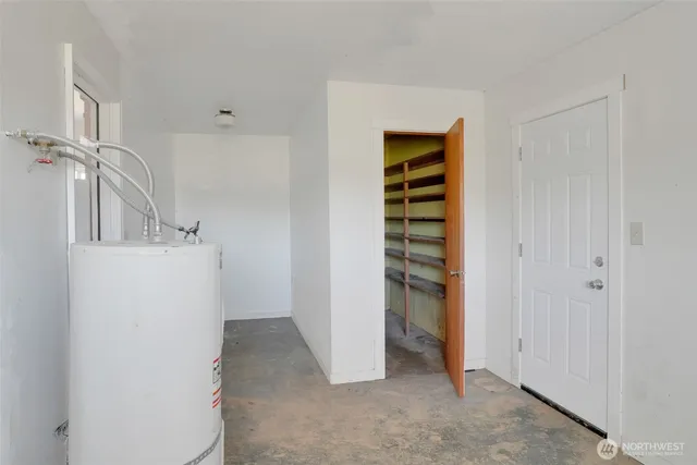 a view of a storage & utility room with washer and dryer