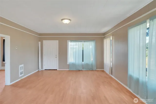 a view of empty room with front door