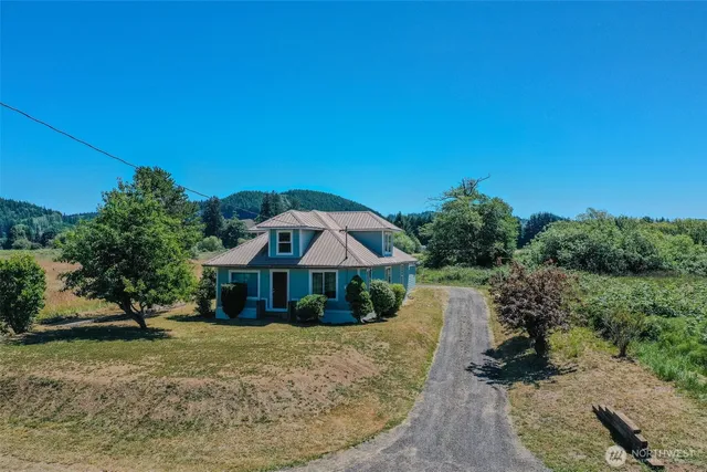 a view of house with yard and entertaining space