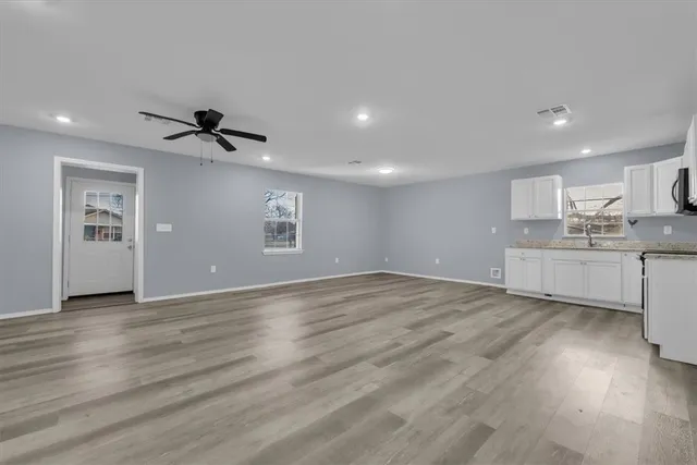 a view of a kitchen with a sink and a window