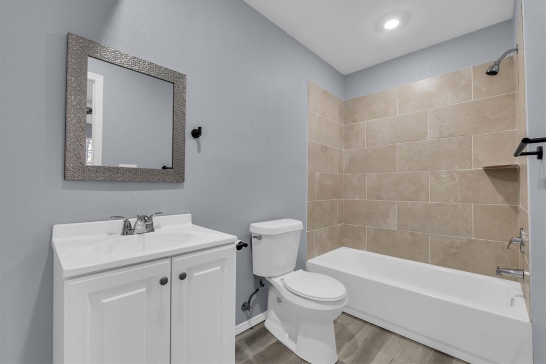902 Calumet Avenue Waco, TX 76704 - Photo 21 of 27 a bathroom with a sink a toilet and shower