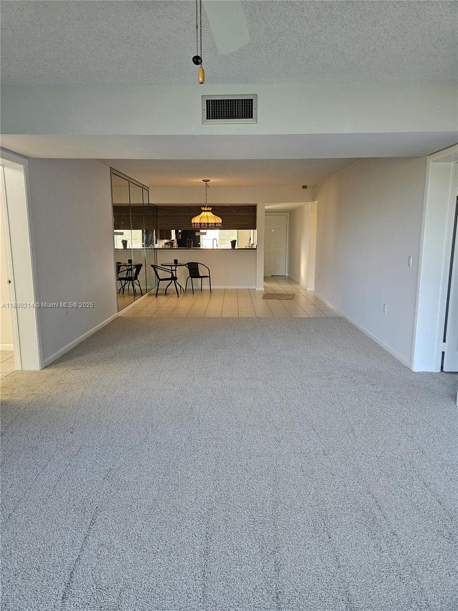 6085 Balboa Circle, Unit 403 Boca Raton, FL 33433 - Photo 11 of 32 a view of a livingroom with furniture and window