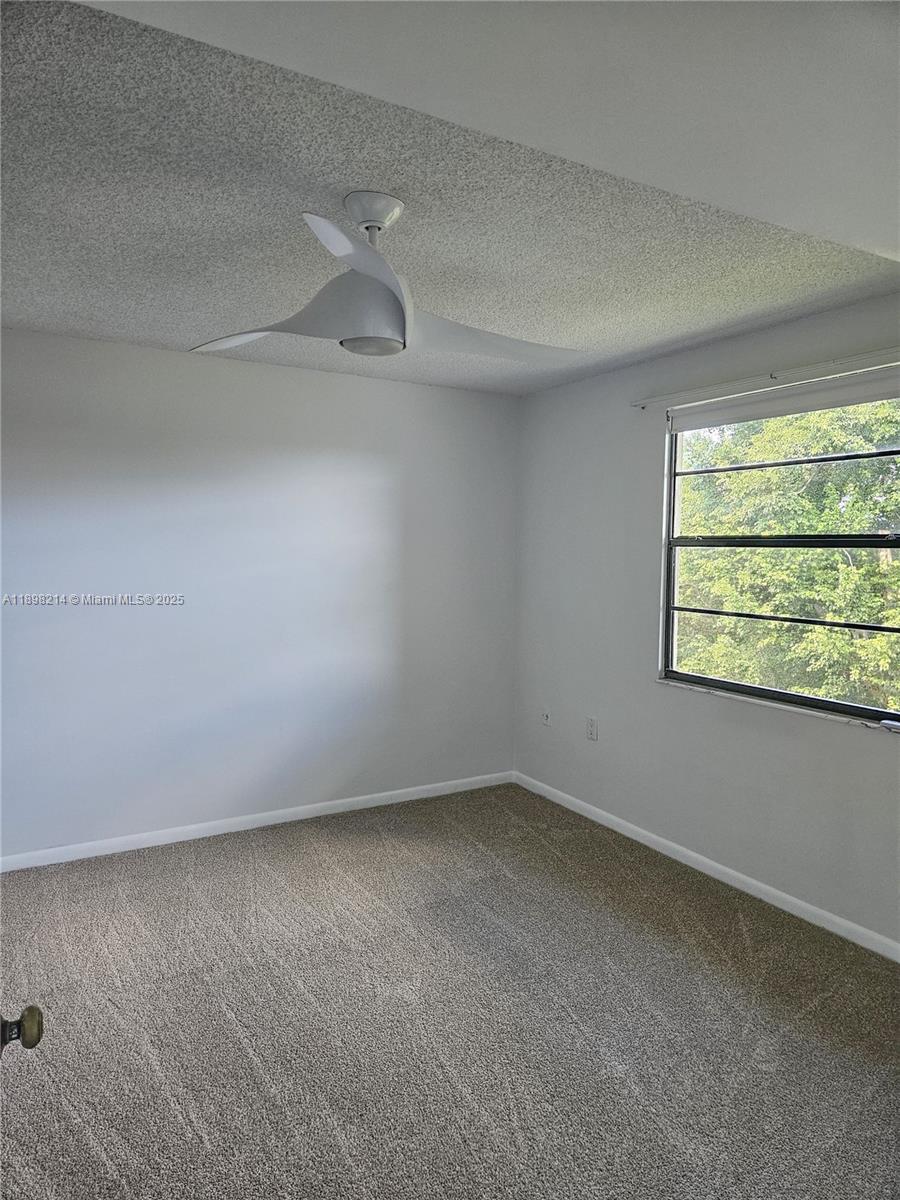 6085 Balboa Circle, Unit 403 Boca Raton, FL 33433 - Photo 13 of 32 a view of an empty room with a window