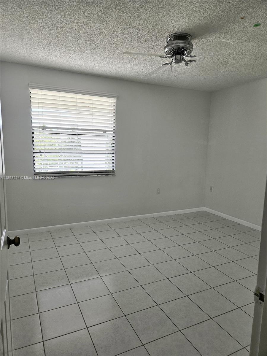 6085 Balboa Circle, Unit 403 Boca Raton, FL 33433 - Photo 19 of 32 a view of an empty room and window