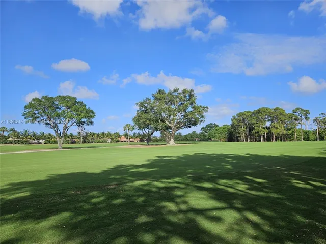 a view of a golf course with a lake
