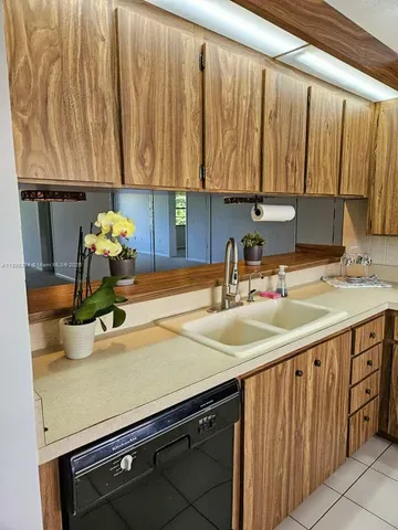 a kitchen with a sink and a cabinets