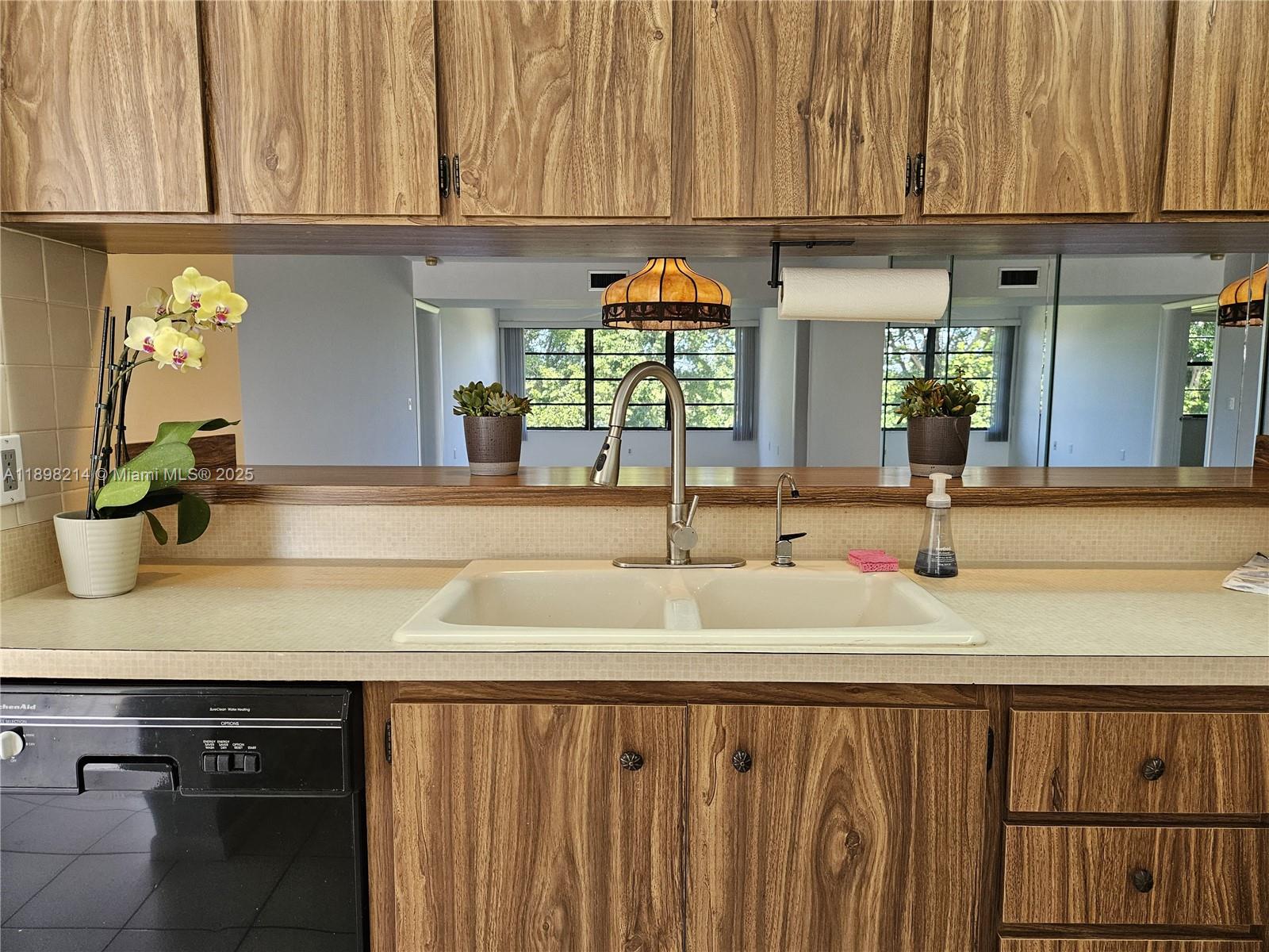 6085 Balboa Circle, Unit 403 Boca Raton, FL 33433 - Photo 5 of 32 a bathroom with a sink and a mirror