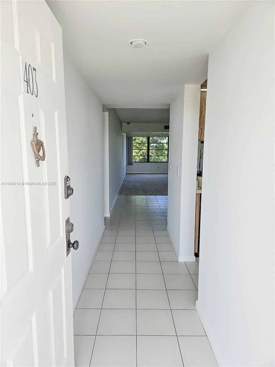 6085 Balboa Circle, Unit 403 Boca Raton, FL 33433 - Photo 7 of 32 a view of a hallway