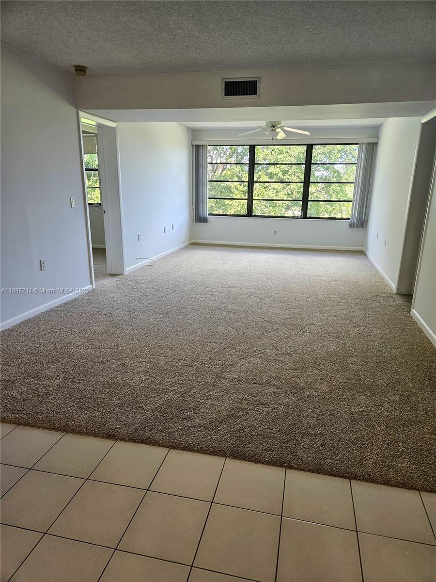 6085 Balboa Circle, Unit 403 Boca Raton, FL 33433 - Photo 9 of 32 a view of an empty room with a window