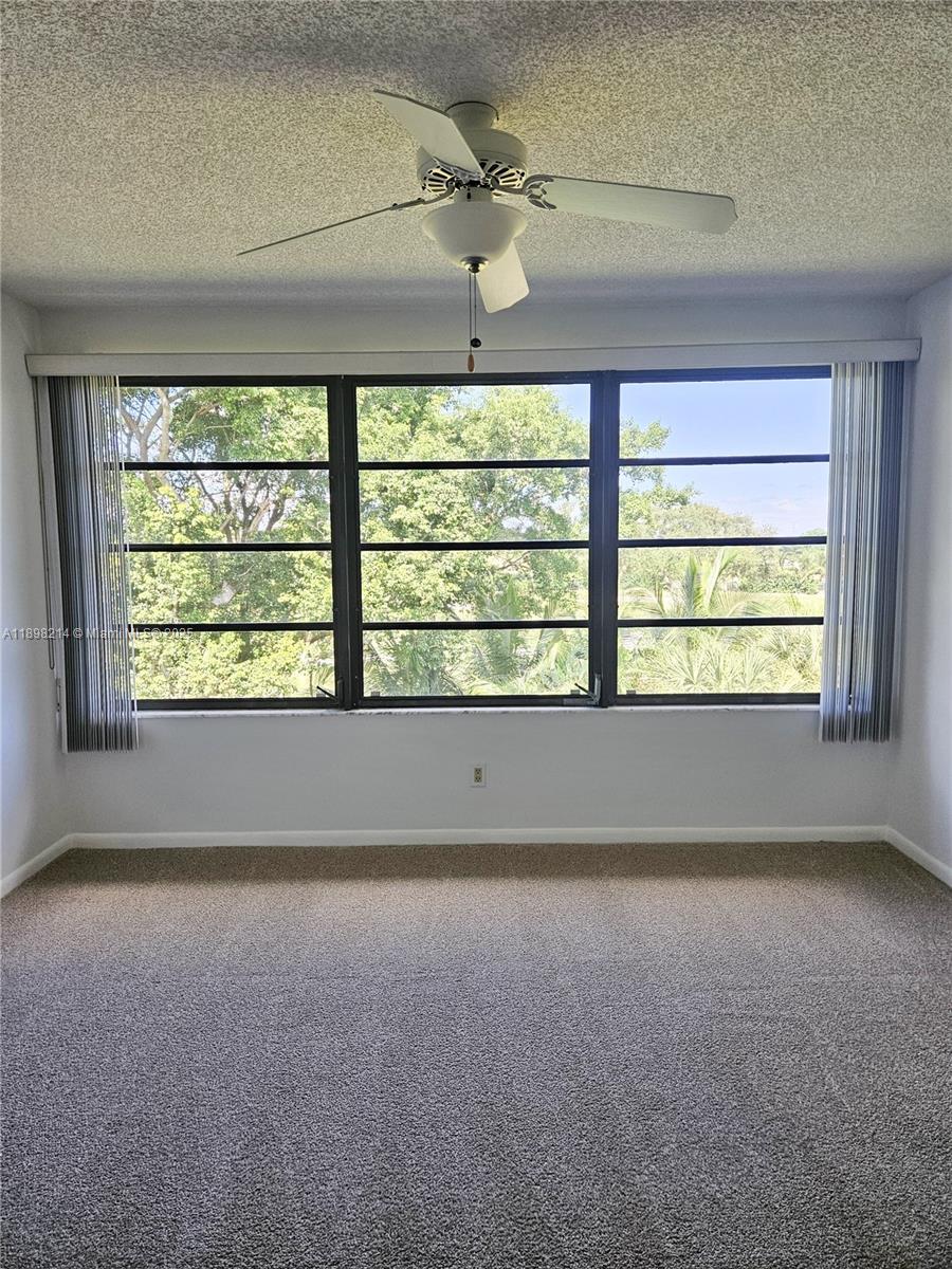 6085 Balboa Circle, Unit 403 Boca Raton, FL 33433 - Photo 10 of 32 an empty room with a window