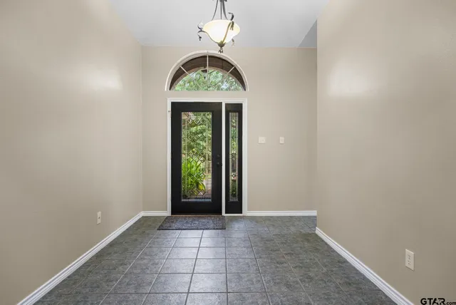 an empty room with windows and mountain view