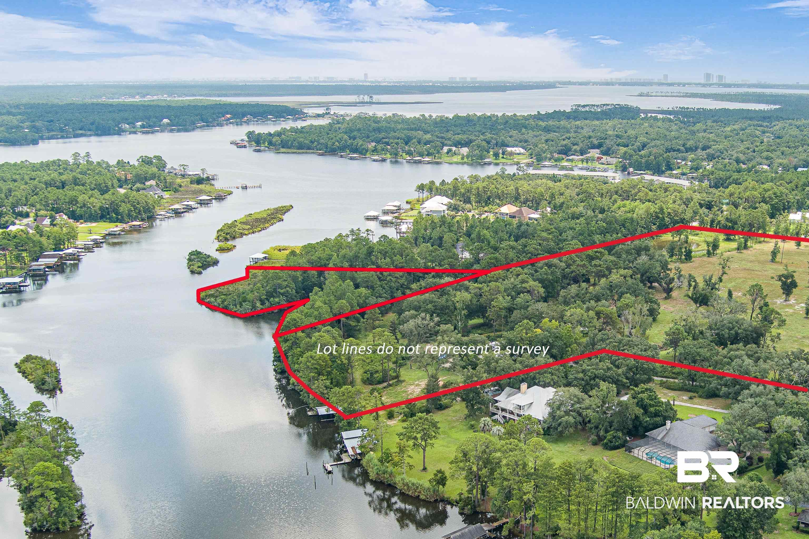 9124 Clarke Ridge Road Foley, AL 36535 - Photo 4 of 8 Aerial view of property and surrounding area featuring a nearby body of water and property boundaries highlighted