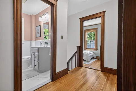 a view of a hallway and a livingroom and a window