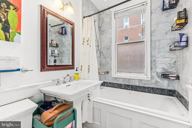 a bathroom with a sink and a bathtub