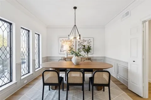 a view of a dining room with furniture window and wooden floor