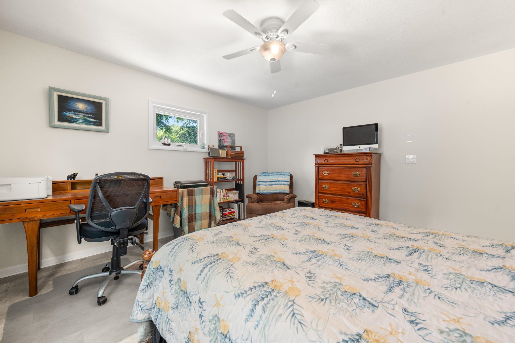 507 Gentian Road St. Augustine, FL 32086 - Photo 25 of 82 a bedroom with a bed and a desk
