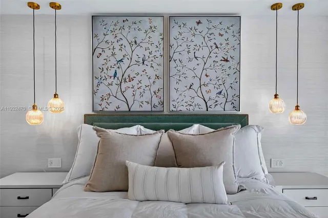 a bedroom with a bed and a night stand