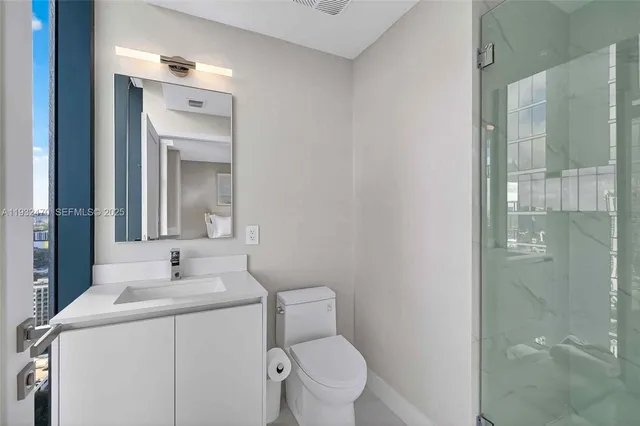 a balcony with furniture and a potted plant