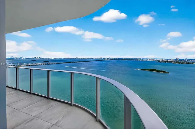 a view of a balcony with an ocean