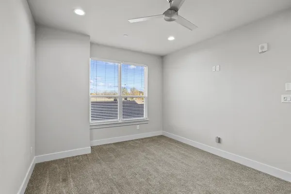 an empty room with a empty space and windows