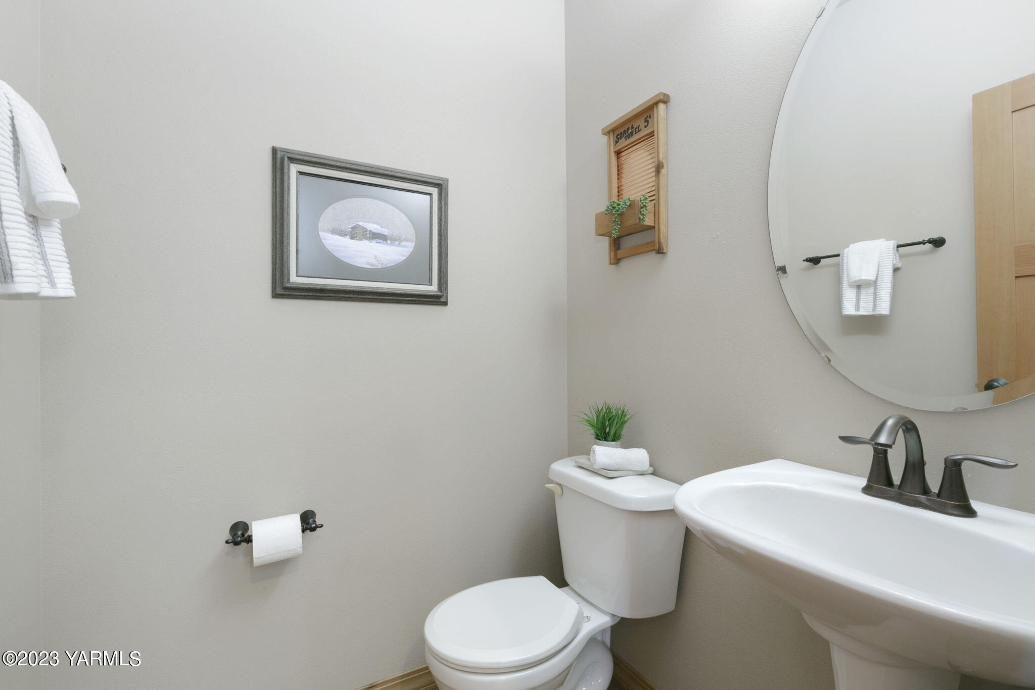 1870 Slavin Road Yakima, WA 98903 - Photo 13 of 27 a white toilet sitting next to a bathroom sink