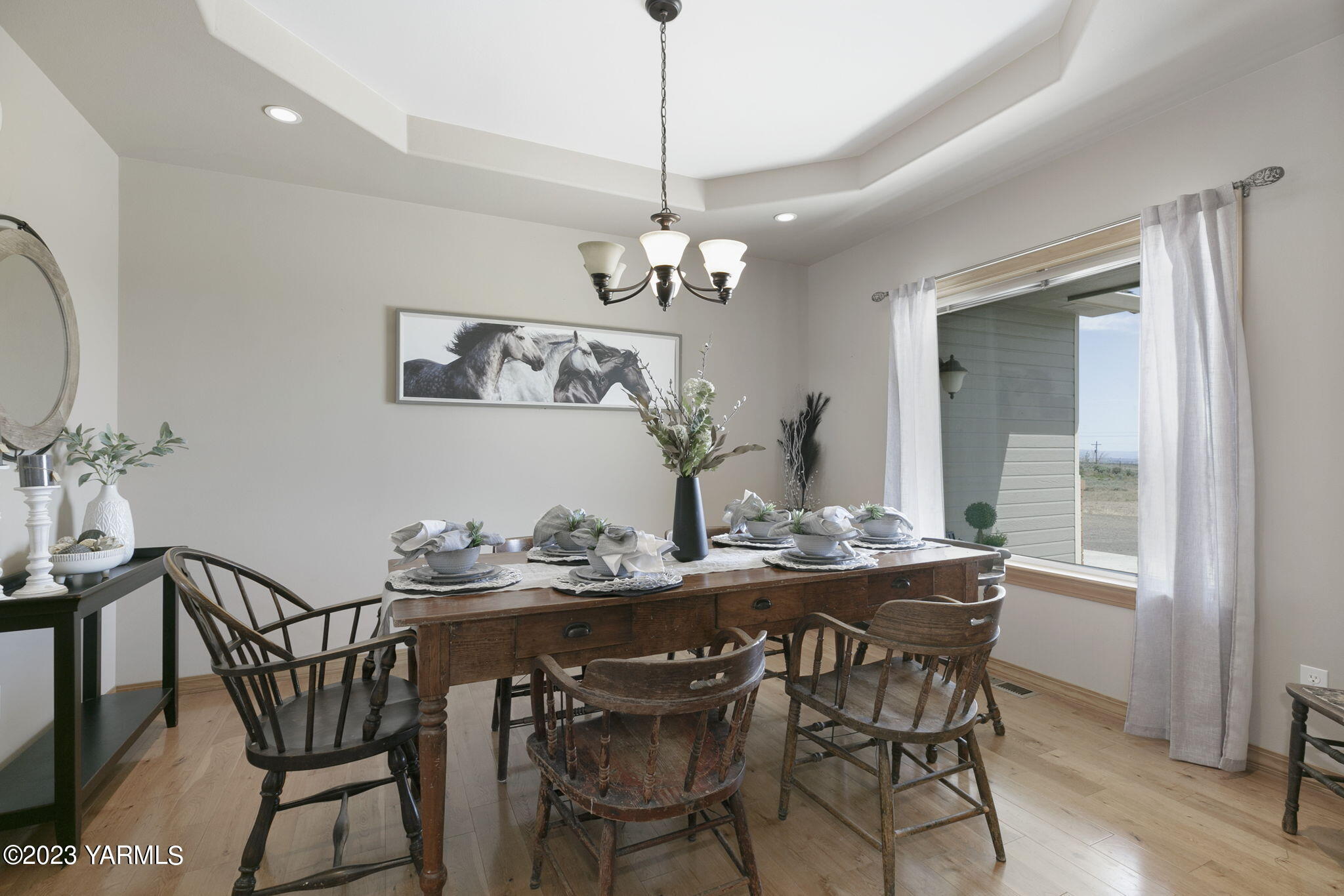 1870 Slavin Road Yakima, WA 98903 - Photo 14 of 27 a view of a dining room with furniture window and wooden floor