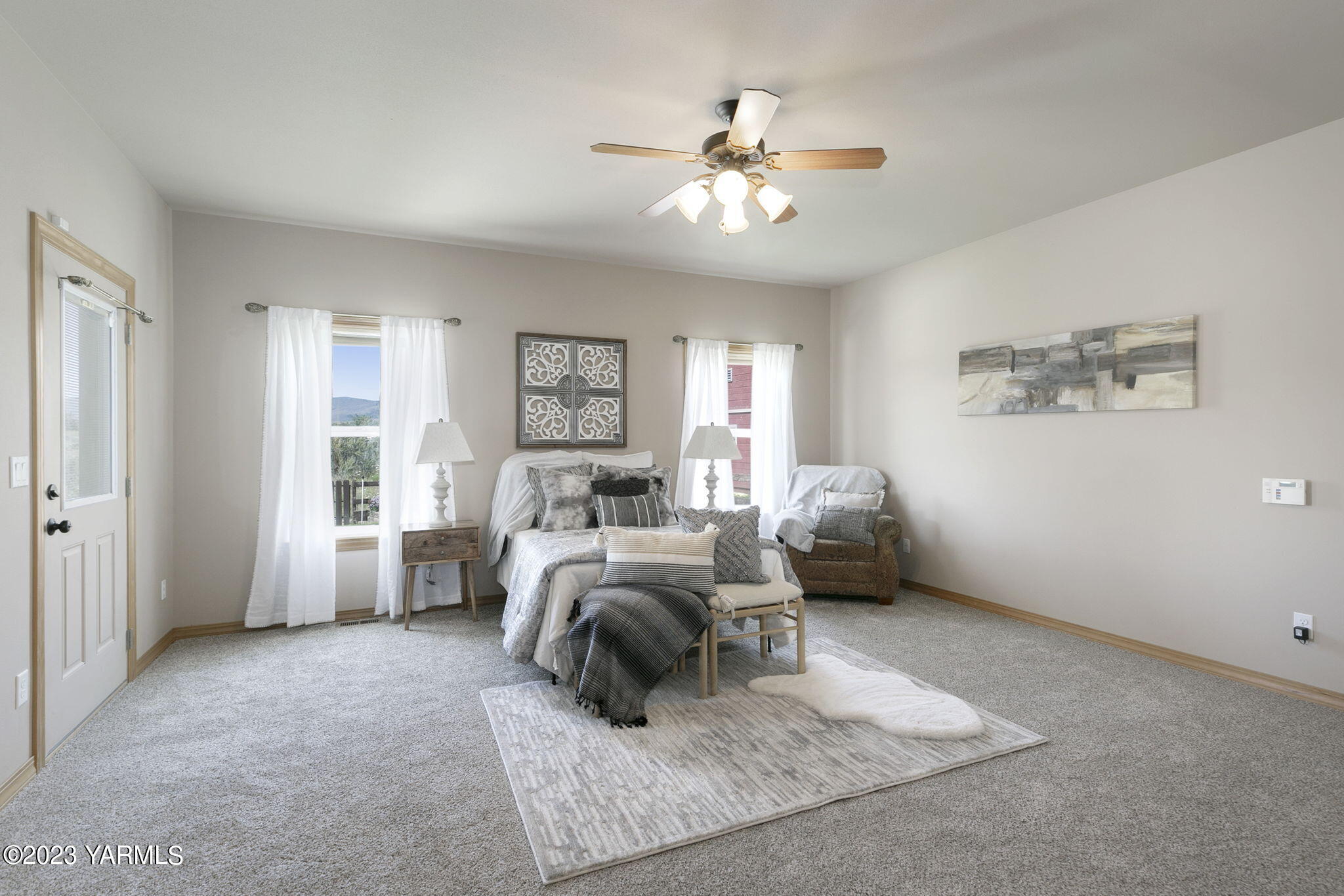 1870 Slavin Road Yakima, WA 98903 - Photo 16 of 27 a bedroom with furniture and a chandelier