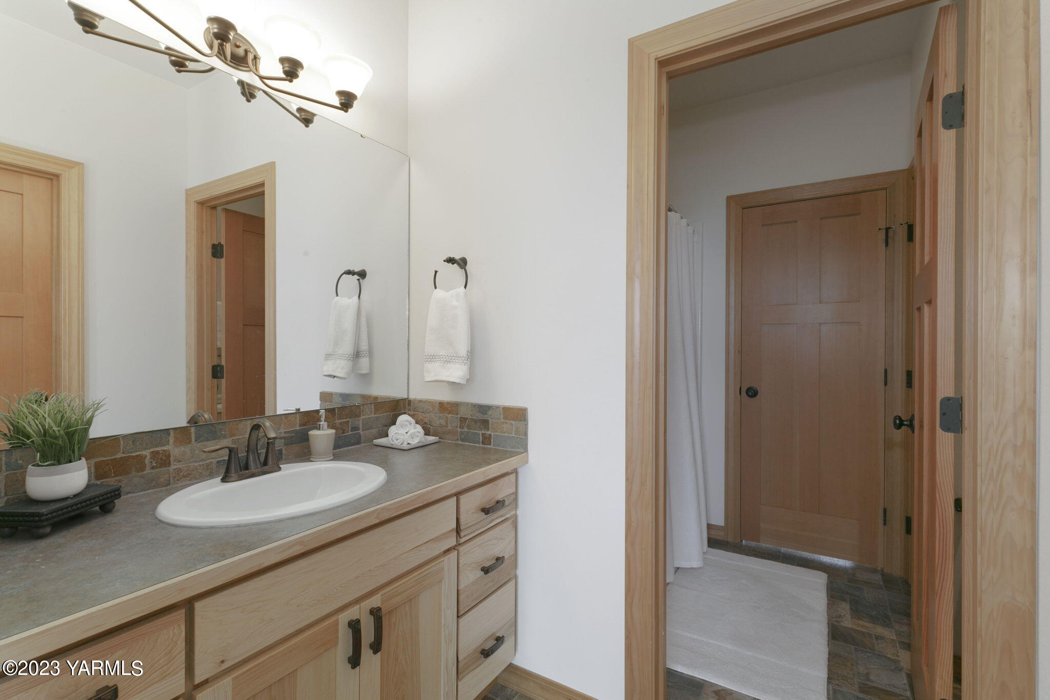 1870 Slavin Road Yakima, WA 98903 - Photo 19 of 27 a bathroom with a granite countertop sink and a mirror