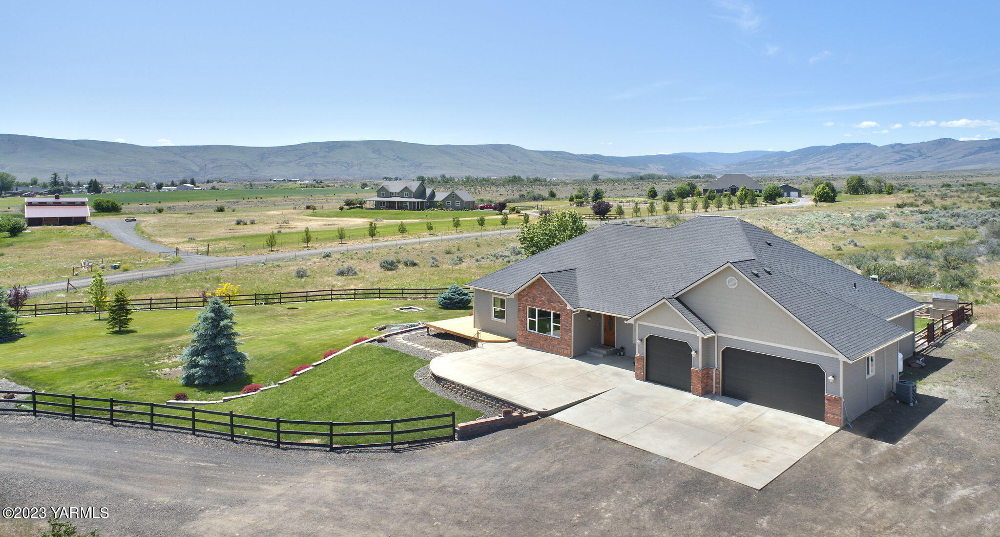 1870 Slavin Road Yakima, WA 98903 - Photo 2 of 27 an aerial view of a house with outdoor space and lake view
